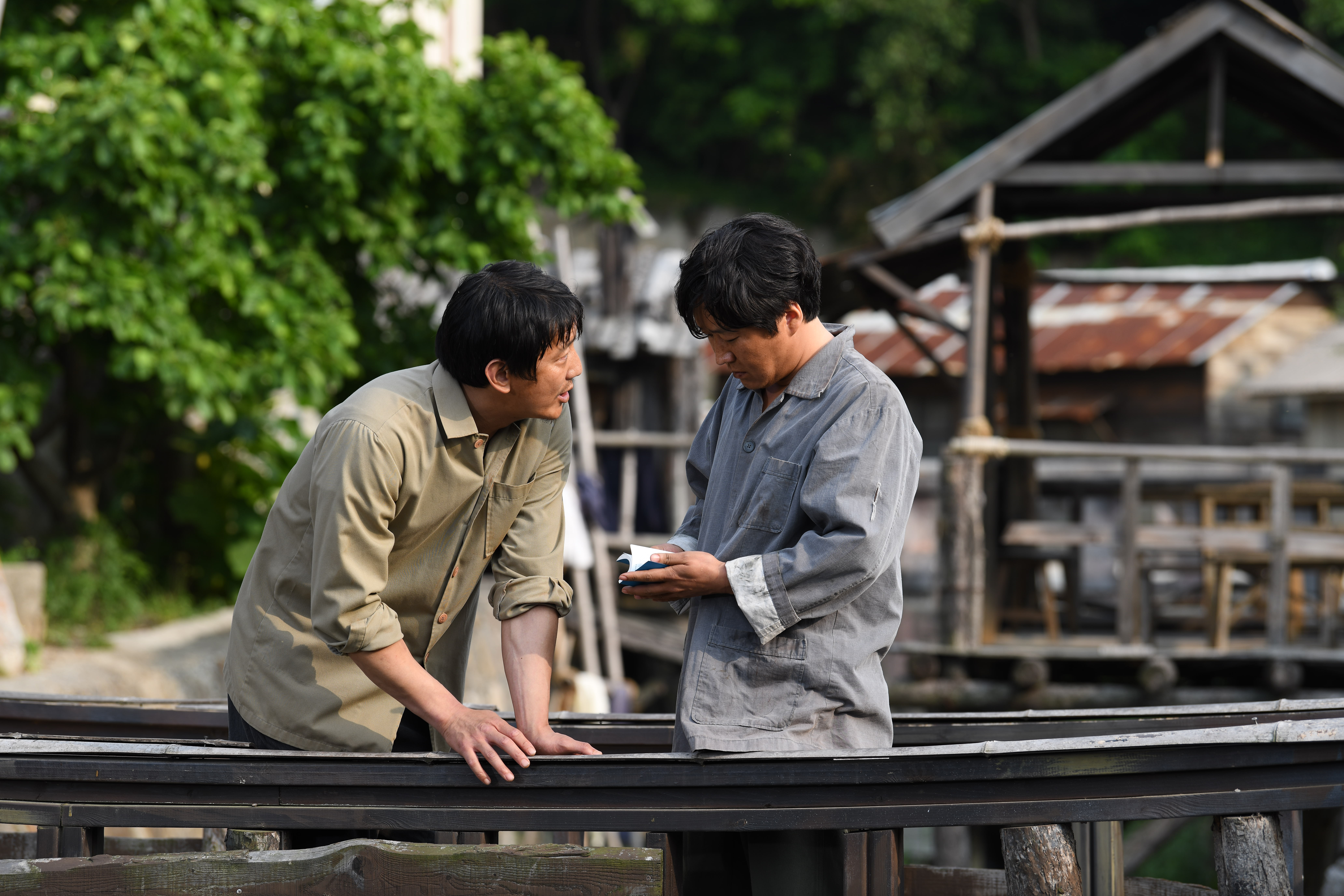 One man with Bible standing with another man